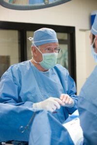 man wearing scrubs and face mask