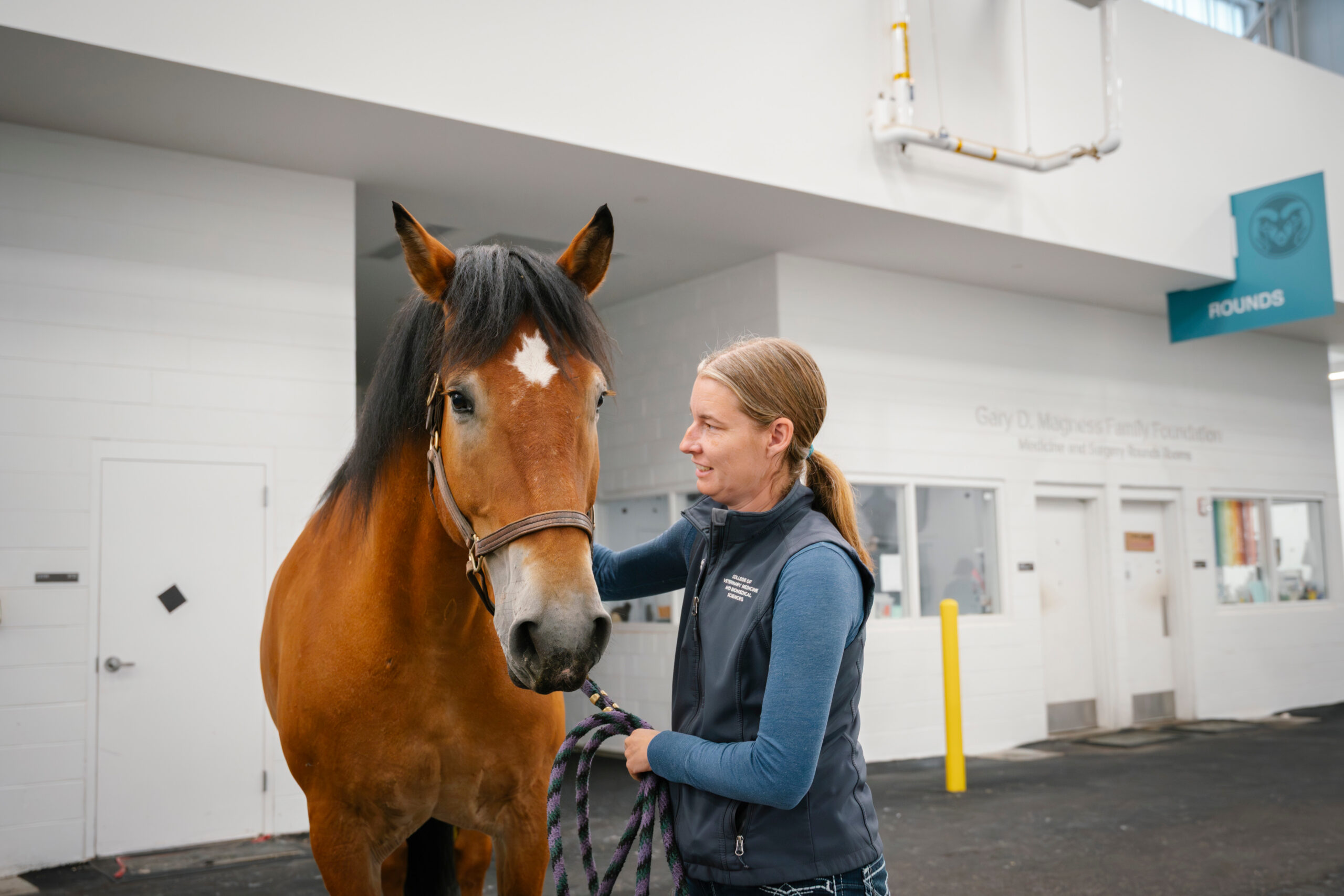 Dr. Rachel Hector with Champ at his first appointment in the clinical trial