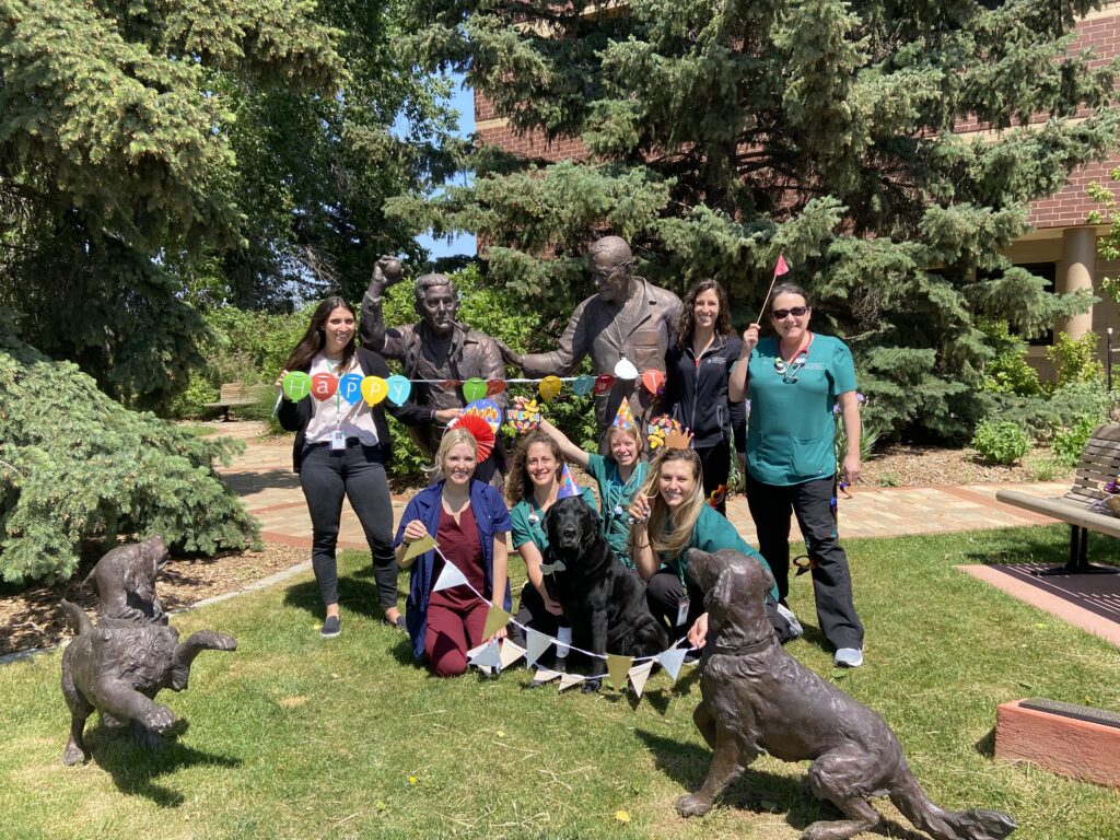 Hughy celebrating his birthday with his care team.